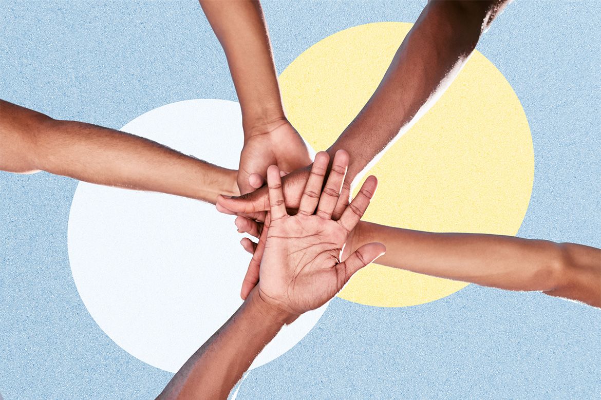 People putting their hands together in the middle